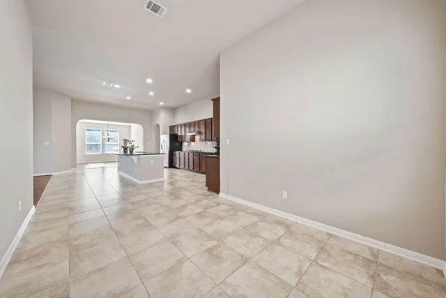 a balcony with wooden floor and fence