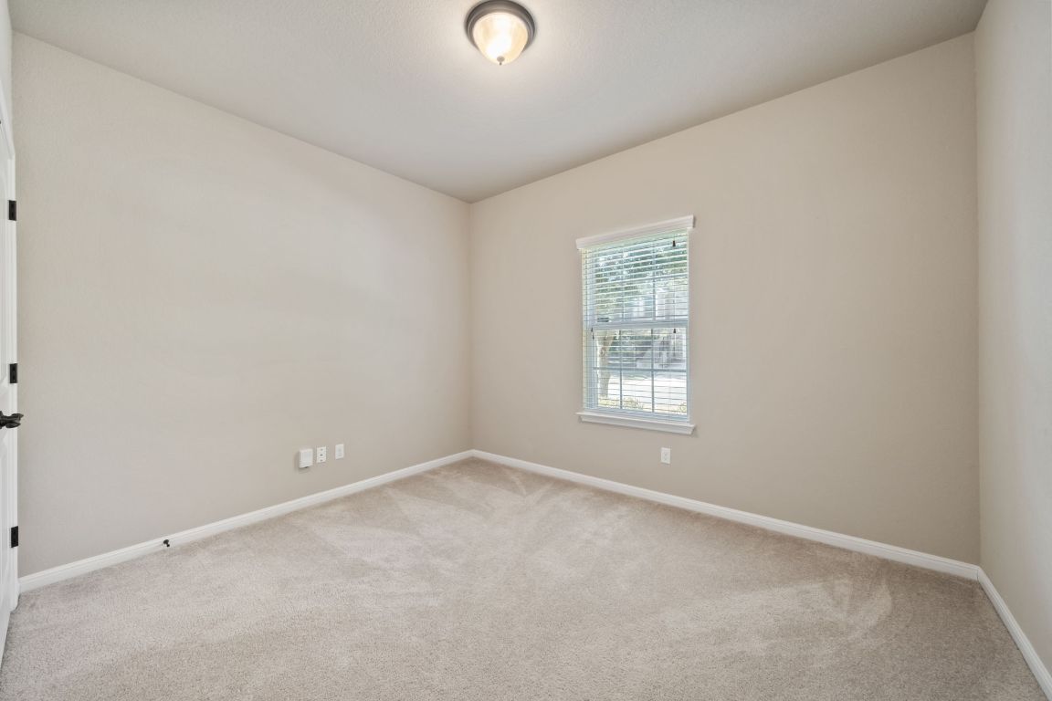 209 Rock Vista Run Austin, TX 78737 - Photo 29 of 40 an empty room with a window