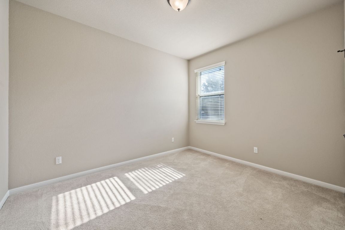 209 Rock Vista Run Austin, TX 78737 - Photo 31 of 40 a view of an empty room with a window