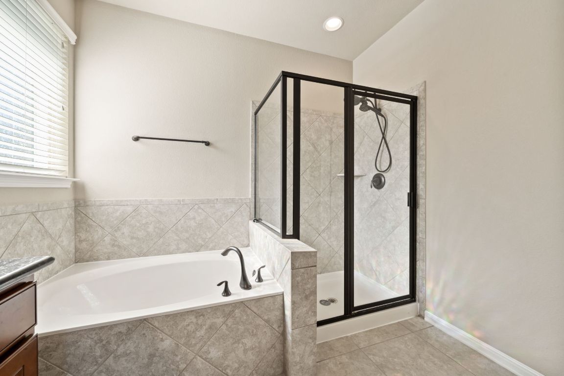 209 Rock Vista Run Austin, TX 78737 - Photo 6 of 40 a bathroom with bathtub and shower