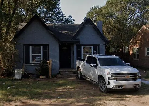 a car parked in front of a house