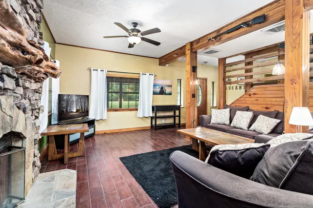 a living room with furniture and a flat screen tv