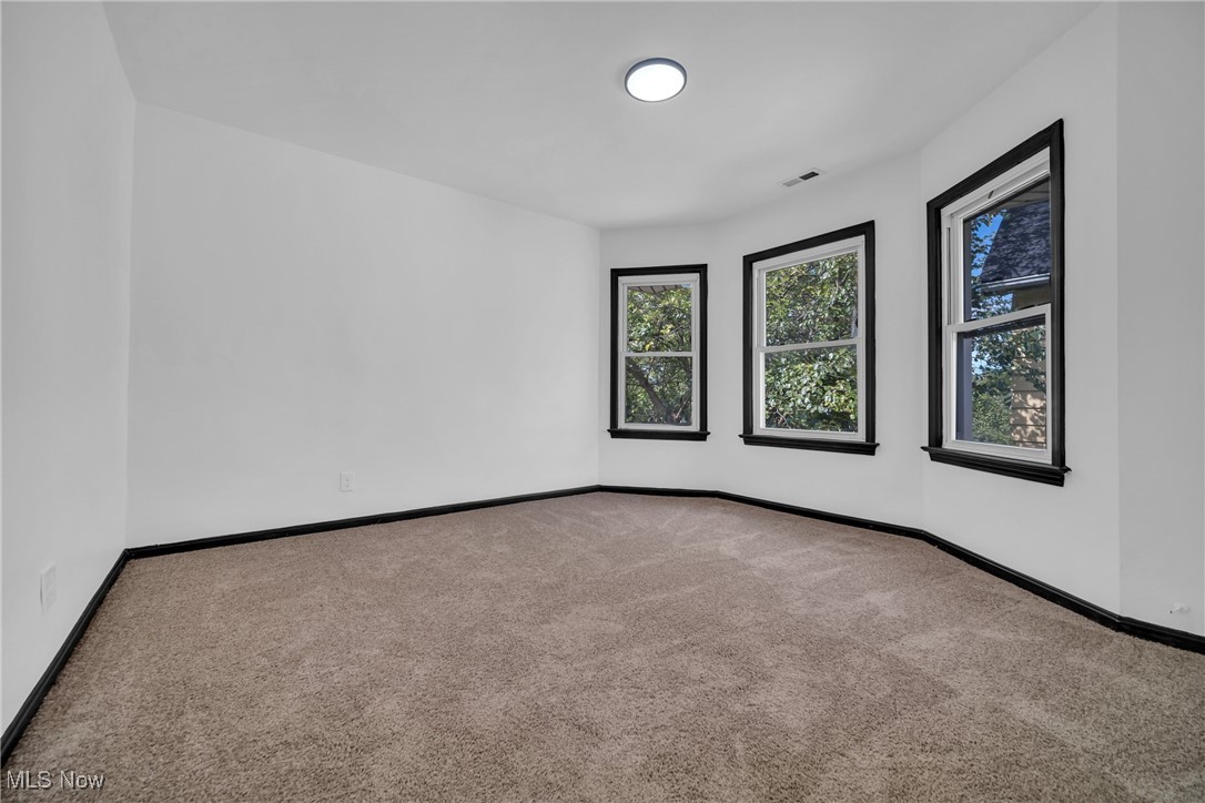 916 Nathaniel Road Cleveland, OH 44110 - Photo 19 of 28 Empty room featuring carpet flooring