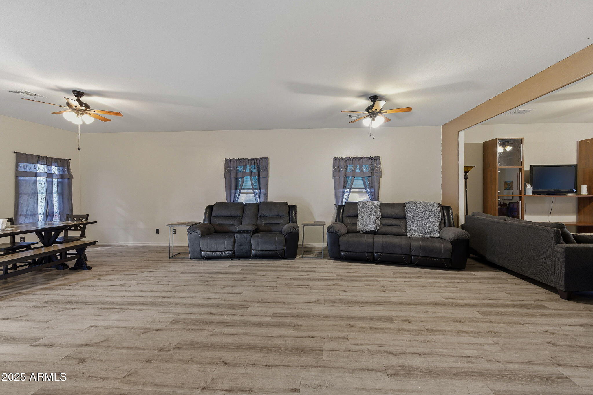 45433 West Sandhill Road Maricopa, AZ 85139 - Photo 13 of 32 a living room with furniture and a wooden floor