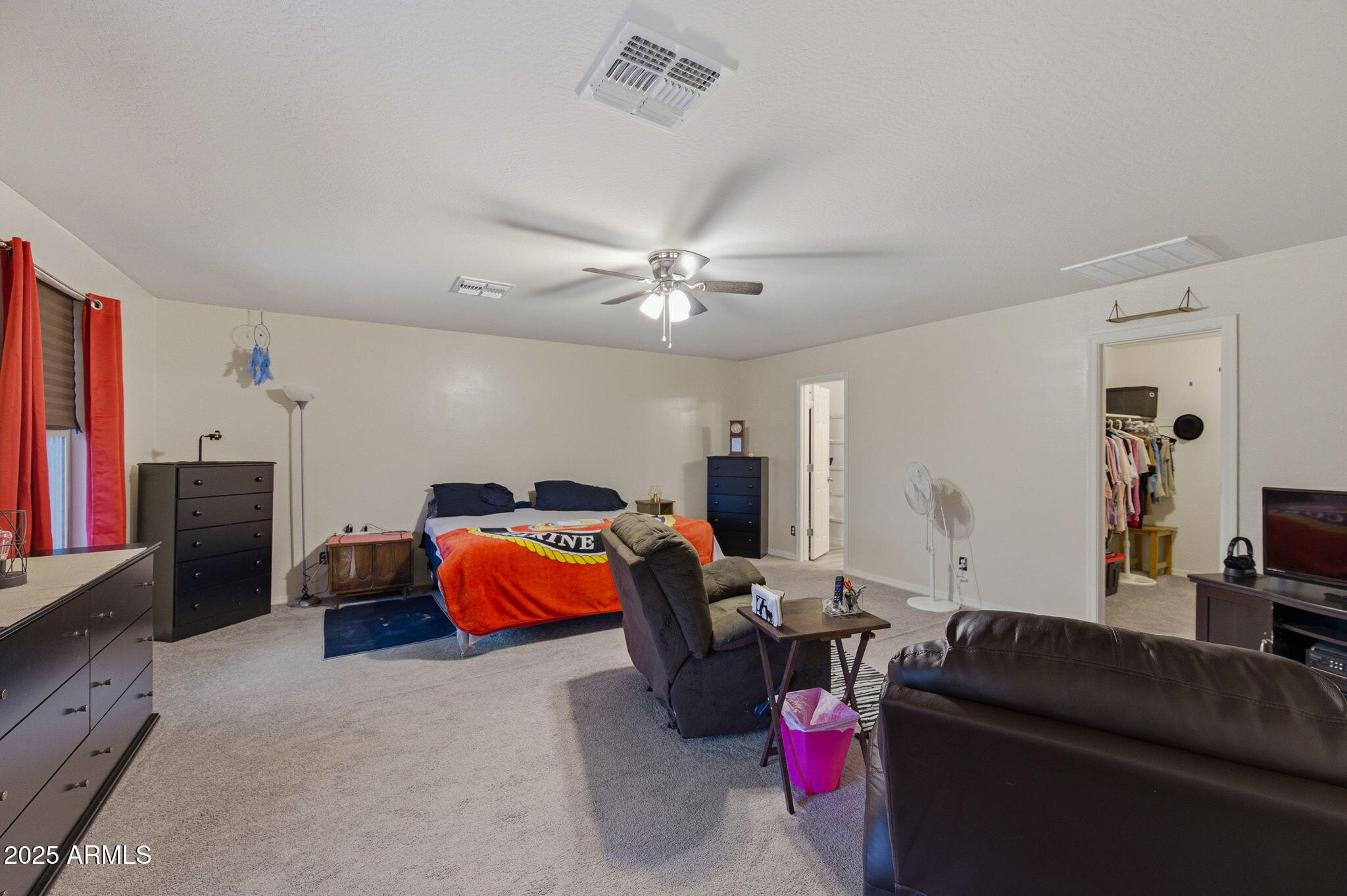 45433 West Sandhill Road Maricopa, AZ 85139 - Photo 15 of 32 a living room with furniture and a flat screen tv