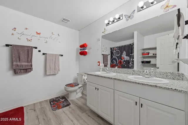 a bedroom with a bed couch and window