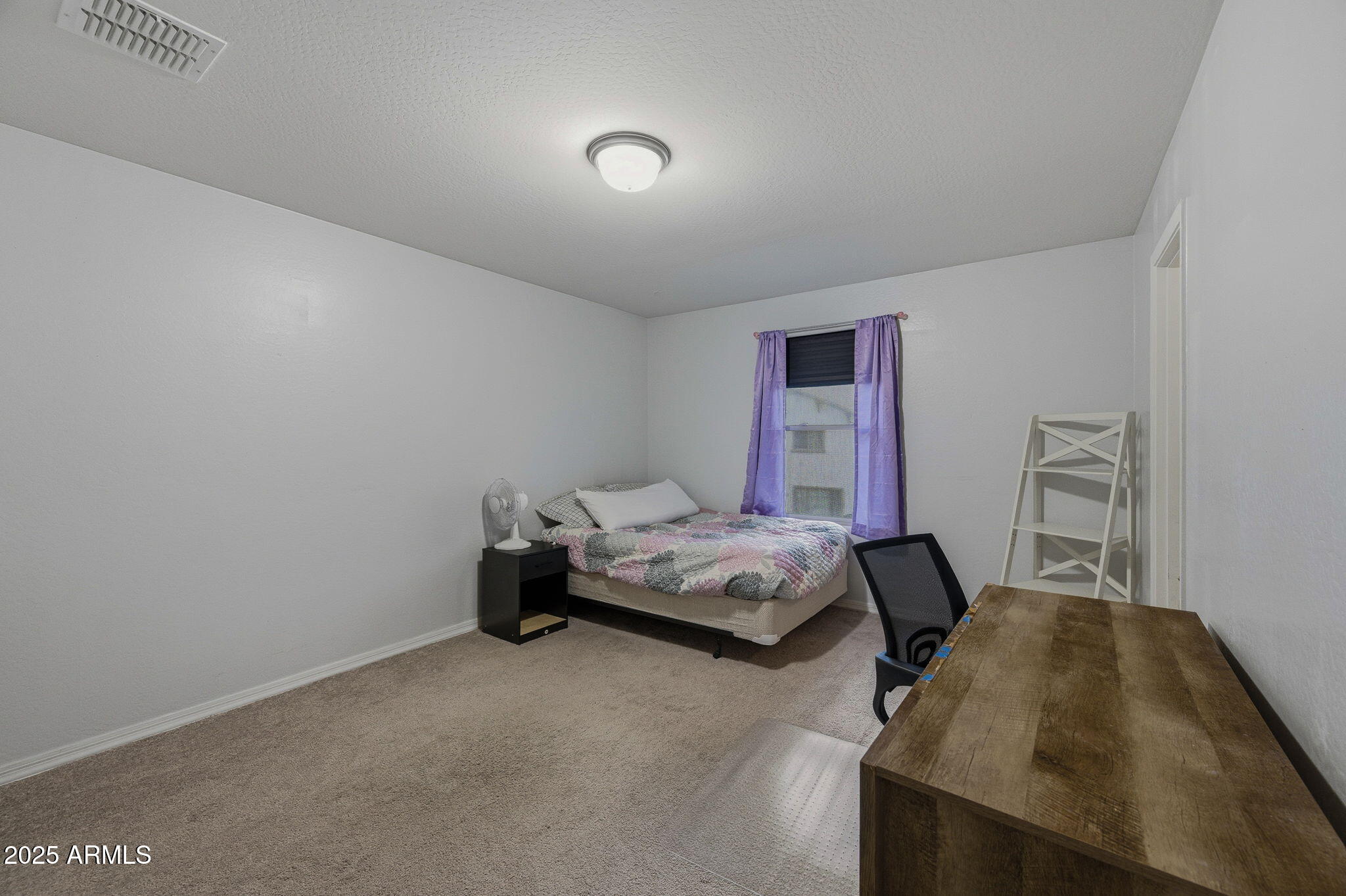 45433 West Sandhill Road Maricopa, AZ 85139 - Photo 22 of 32 a bedroom with a bed and a window