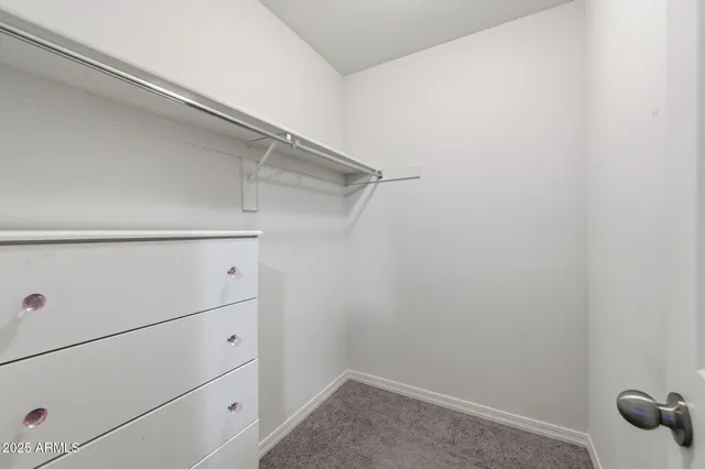 a bathroom with a granite countertop sink a mirror and vanity