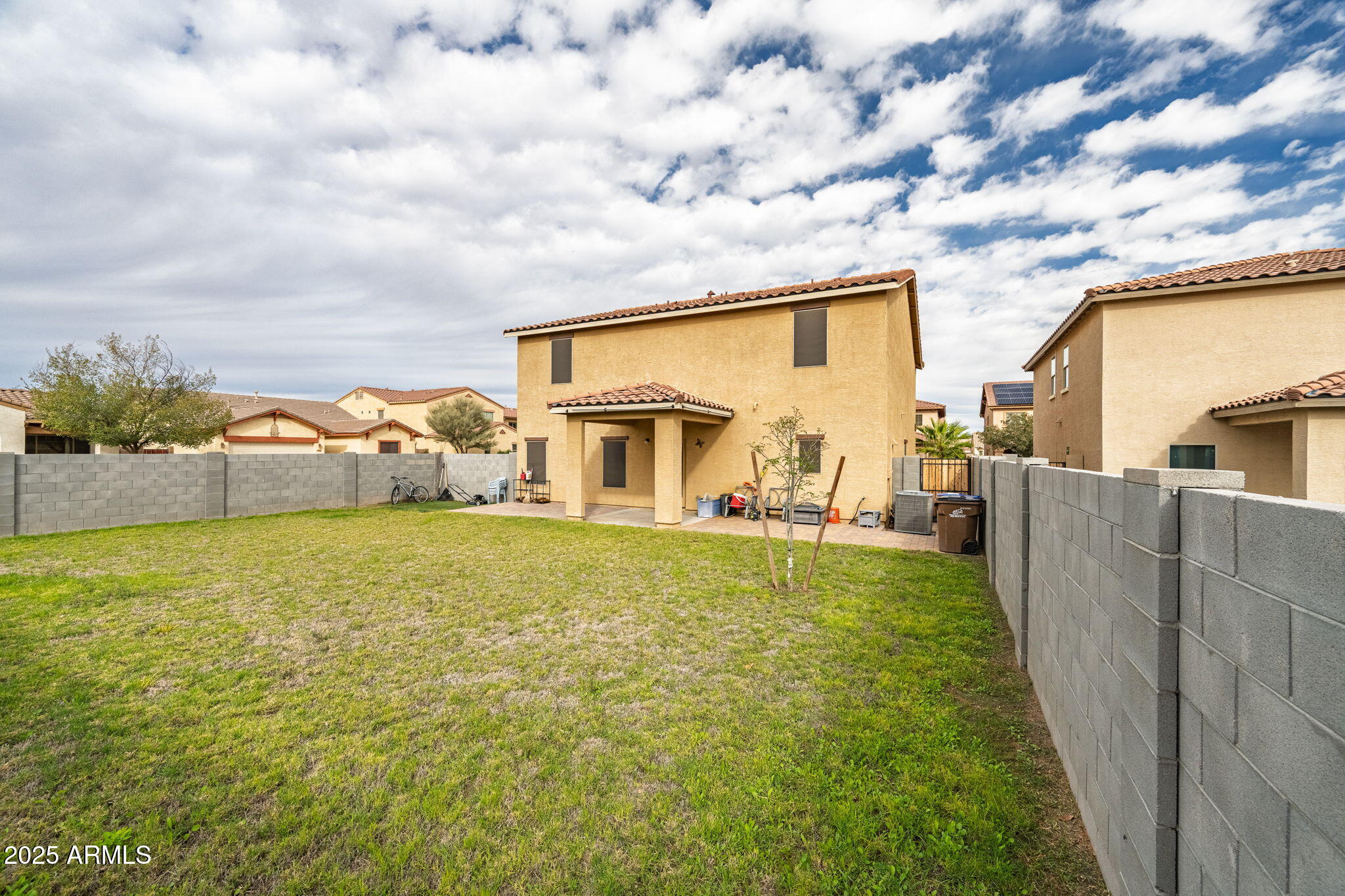 45433 West Sandhill Road Maricopa, AZ 85139 - Photo 29 of 32 a view of an house with backyard space and balcony
