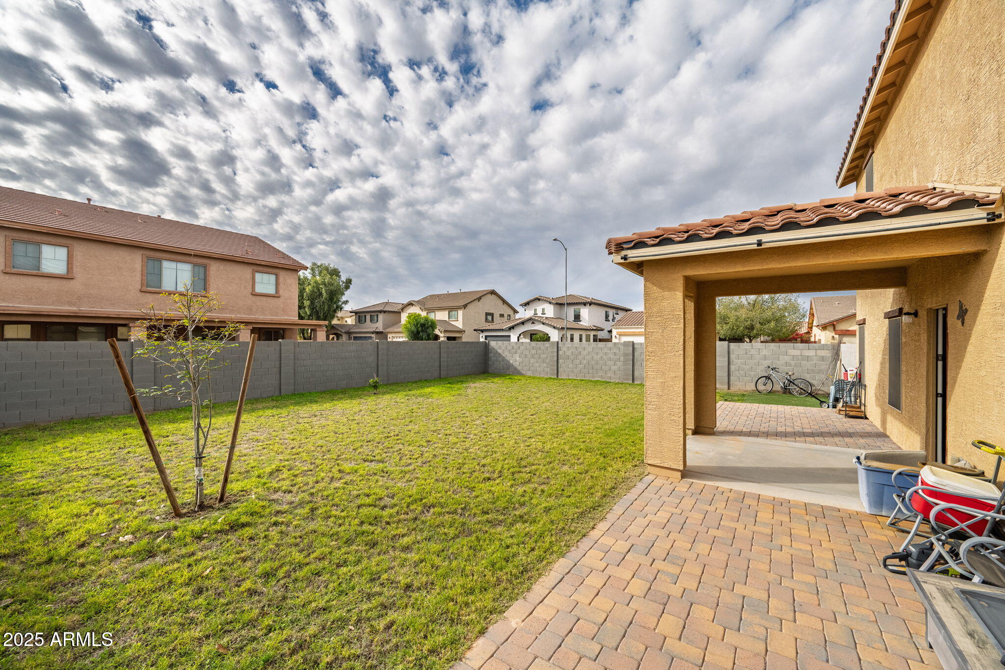 45433 West Sandhill Road Maricopa, AZ 85139 - Photo 30 of 32 a view of a house with backyard porch and wooden floor