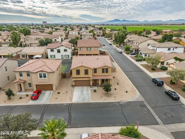 an aerial view of residential houses with outdoor space