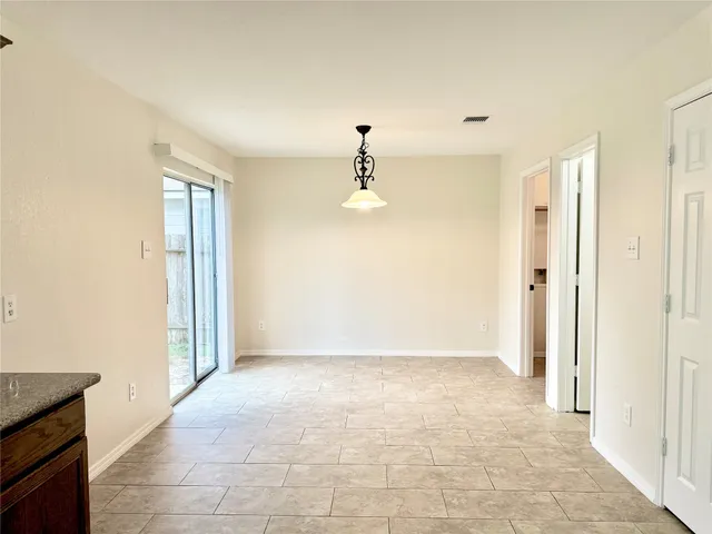 a kitchen with stainless steel appliances a sink stove and cabinets