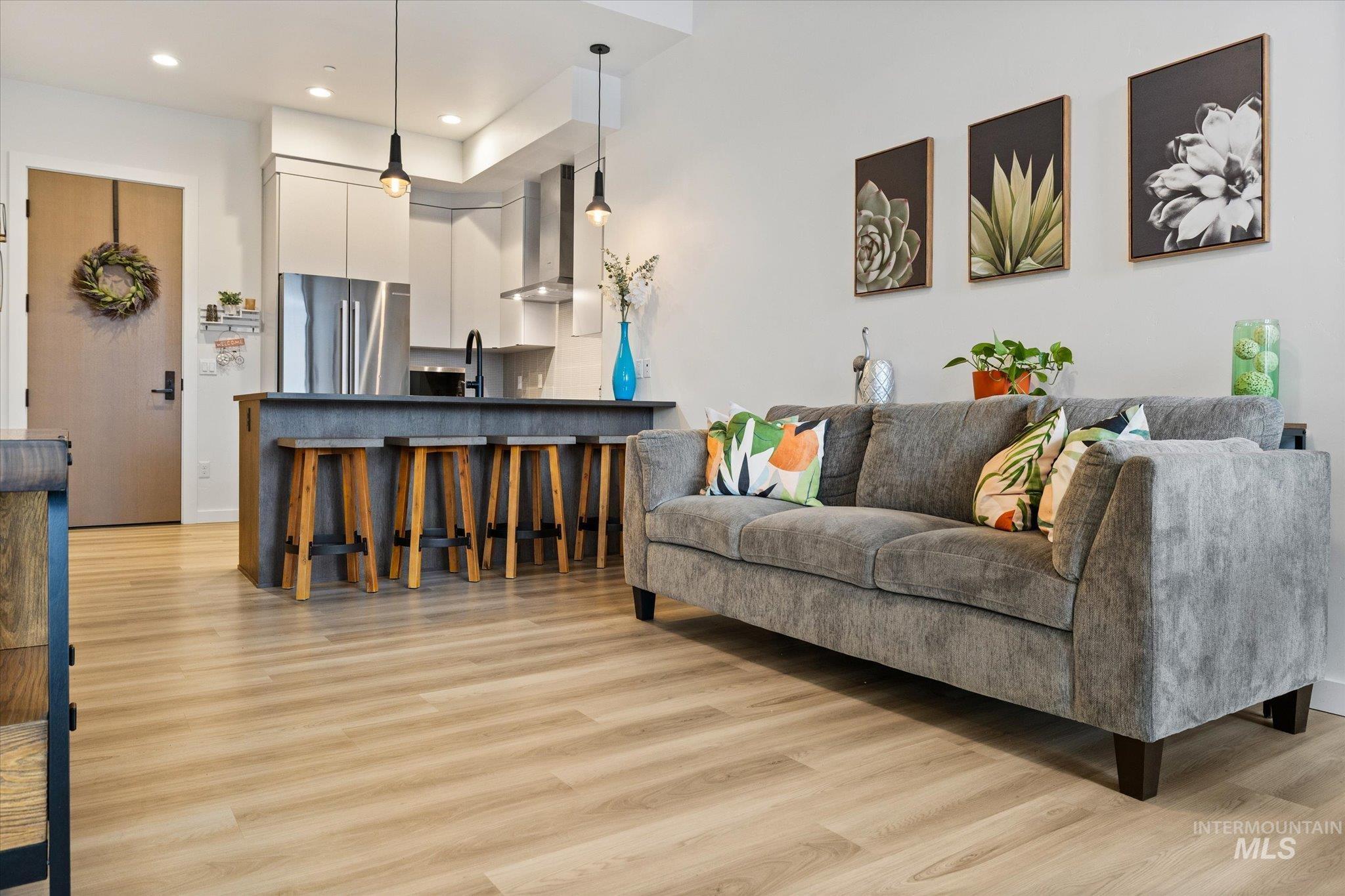 3850 East Haystack Street, Unit 302 Boise, ID 83716 - Photo 14 of 50 Living area with light wood finished floors and recessed lighting