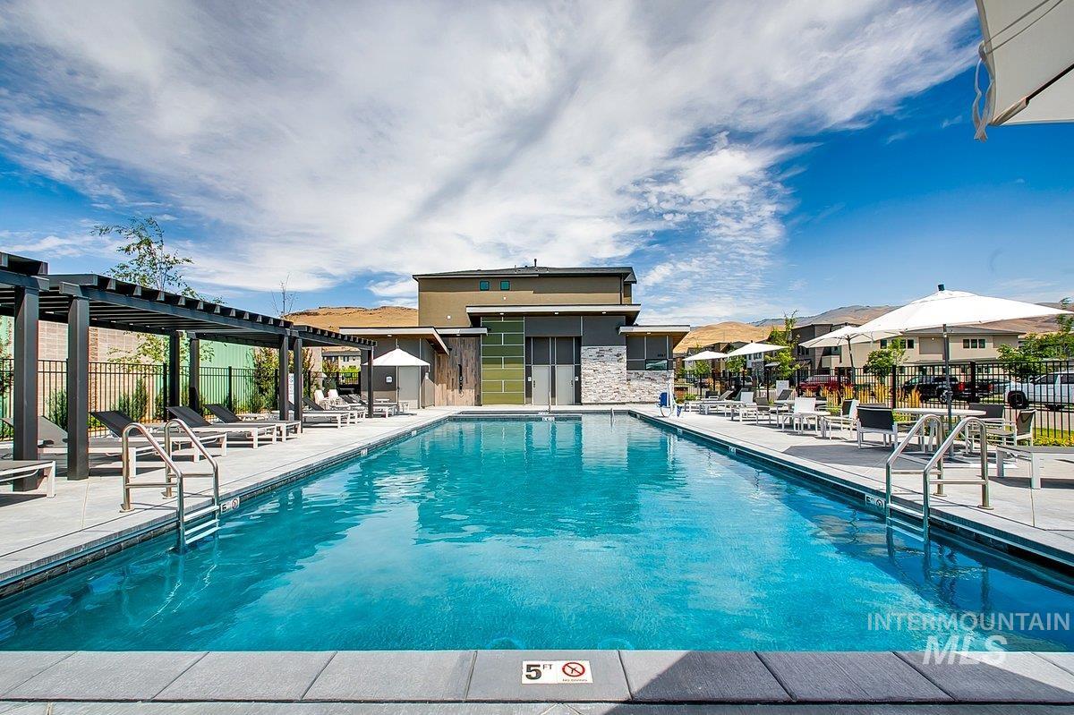 3850 East Haystack Street, Unit 302 Boise, ID 83716 - Photo 22 of 50 Community pool featuring a patio and a pergola