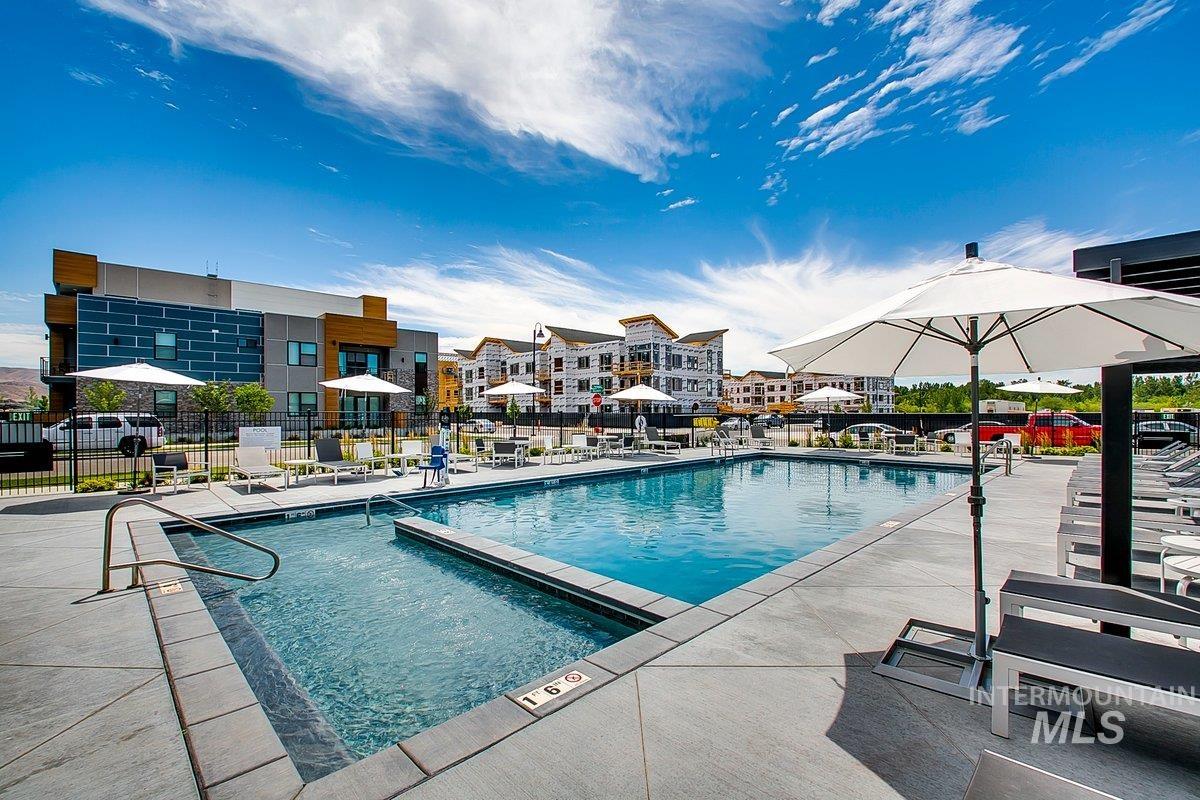 3850 East Haystack Street, Unit 302 Boise, ID 83716 - Photo 23 of 50 Community pool featuring a patio area
