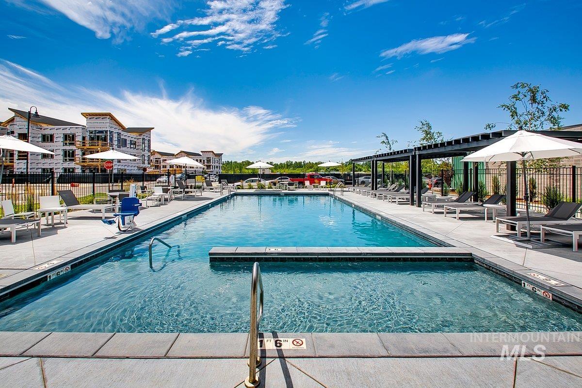3850 East Haystack Street, Unit 302 Boise, ID 83716 - Photo 24 of 50 Community pool with a patio