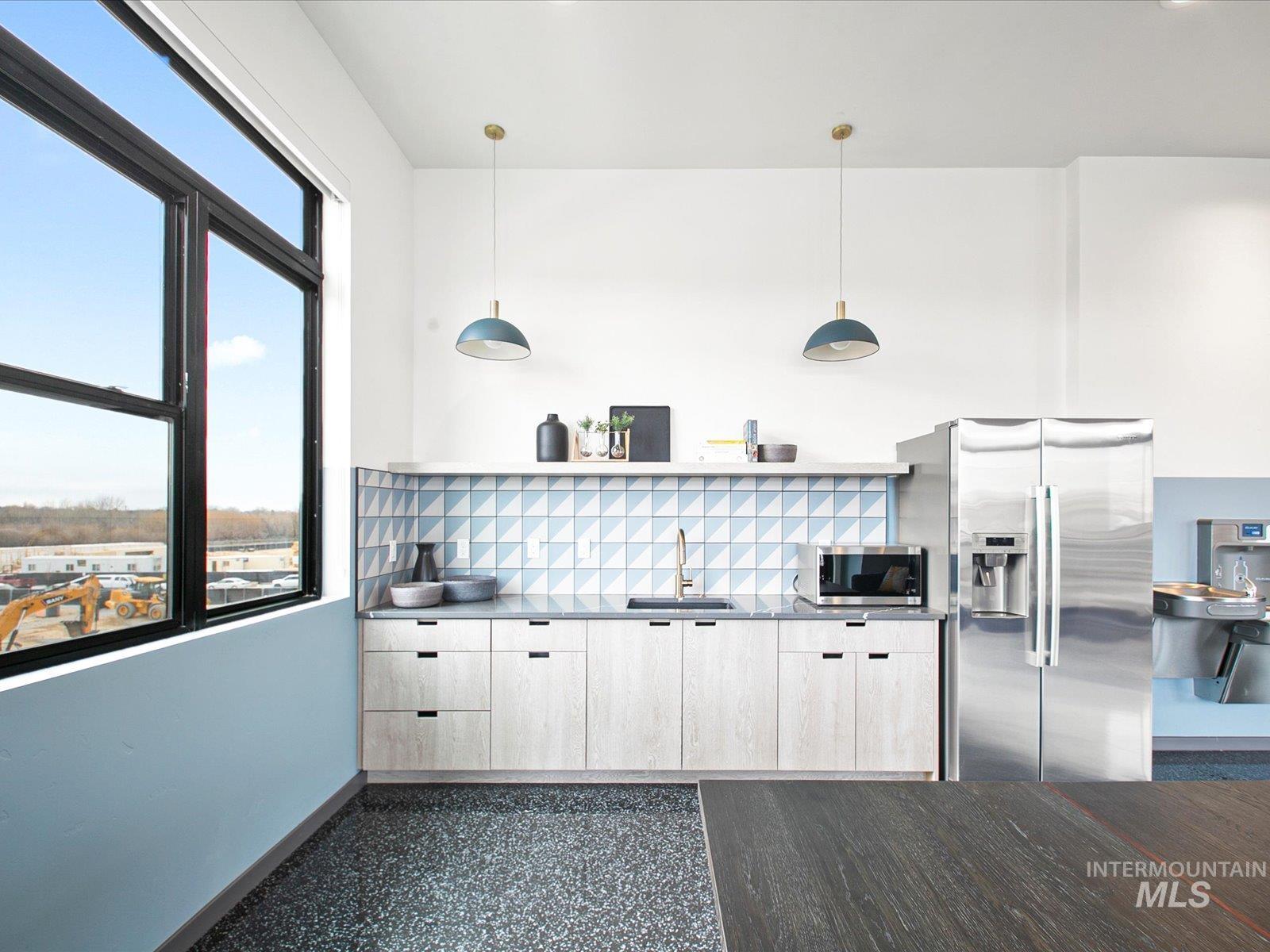 3850 East Haystack Street, Unit 302 Boise, ID 83716 - Photo 39 of 50 Kitchen featuring open shelves, stainless steel appliances, pendant lighting, and tasteful backsplash