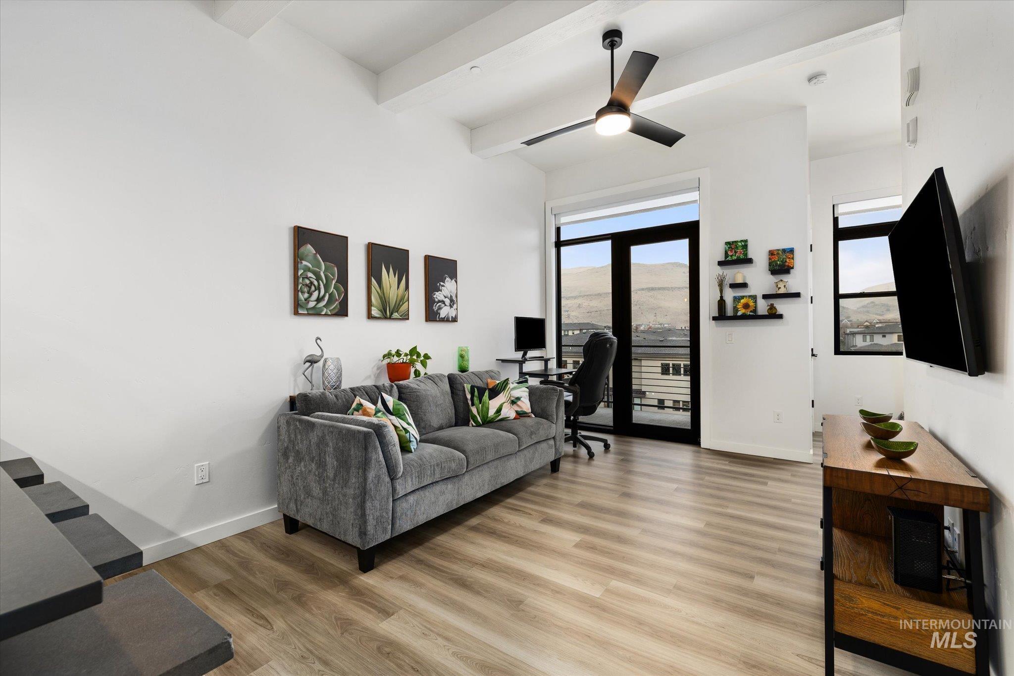 3850 East Haystack Street, Unit 302 Boise, ID 83716 - Photo 8 of 50 Living room with an office area, beam ceiling, light wood finished floors, and a ceiling fan