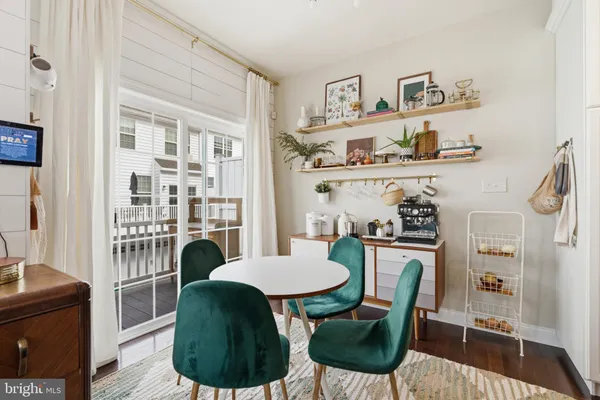 a view of kitchen with dining table and chairs
