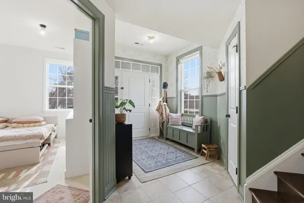 a living room with furniture and kitchen view