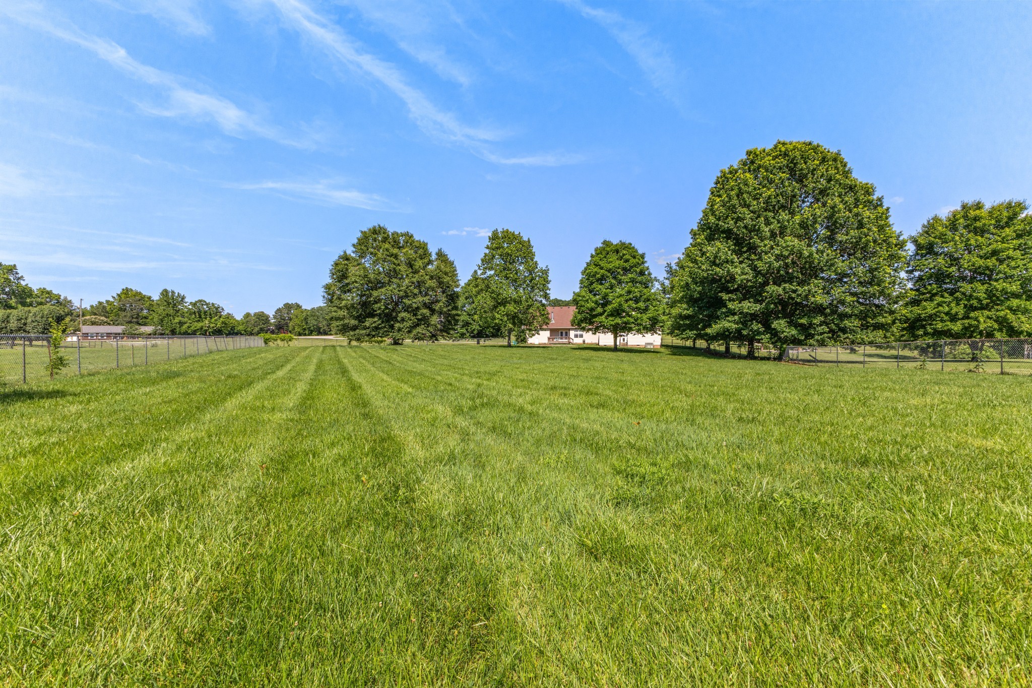 1010 Jacob's Valley Road Joelton, TN 37080 - Photo 2 of 33 a yard with lots of green space and a building in the back