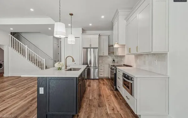 a kitchen with a stove and a table