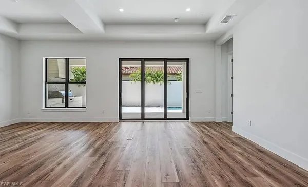 a view of kitchen with kitchen island sink and center island