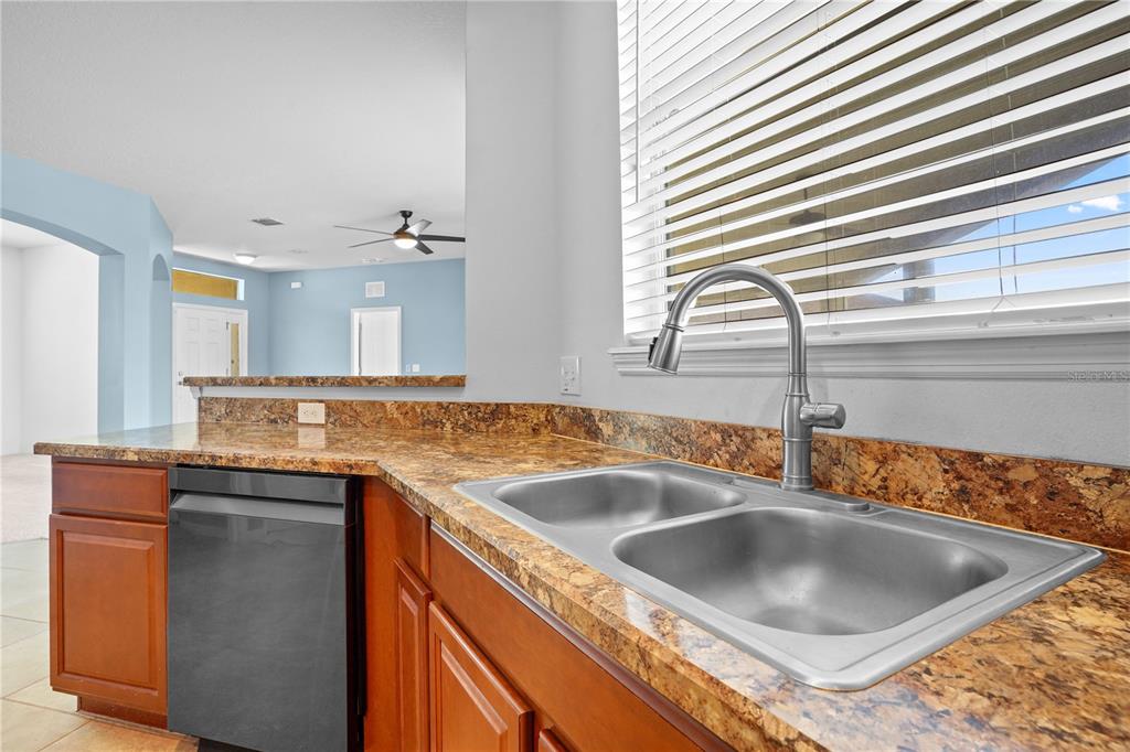 222 Blackstone Creek Road Groveland, FL 34736 - Photo 16 of 49 a kitchen with a sink and a window