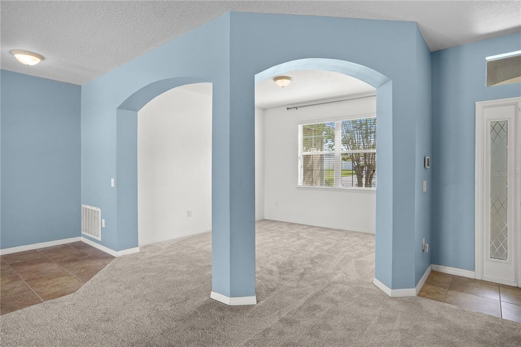 222 Blackstone Creek Road Groveland, FL 34736 - Photo 17 of 49 an empty room with windows and closet