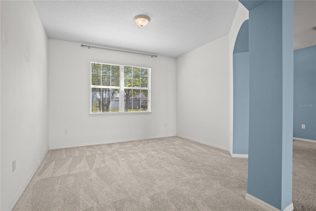 222 Blackstone Creek Road Groveland, FL 34736 - Photo 18 of 49 an empty room with a window