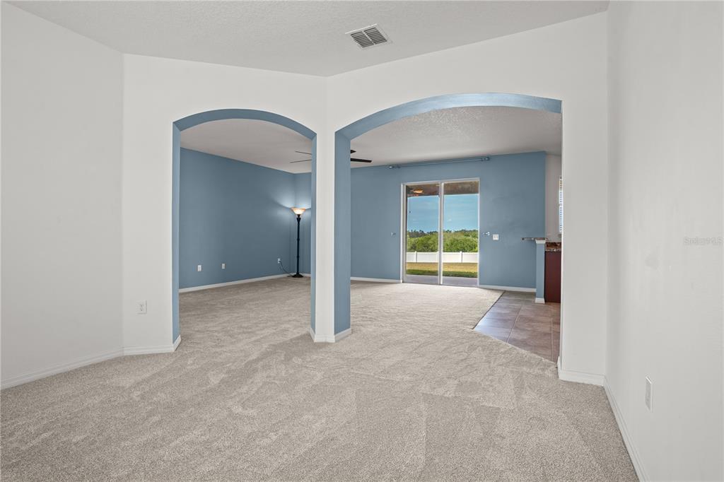 222 Blackstone Creek Road Groveland, FL 34736 - Photo 19 of 49 a view of a big room with closet and wooden floor