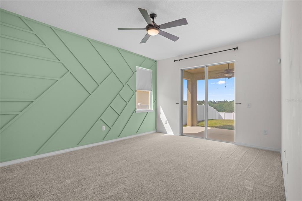 222 Blackstone Creek Road Groveland, FL 34736 - Photo 20 of 49 a view of a livingroom with a ceiling fan and a window
