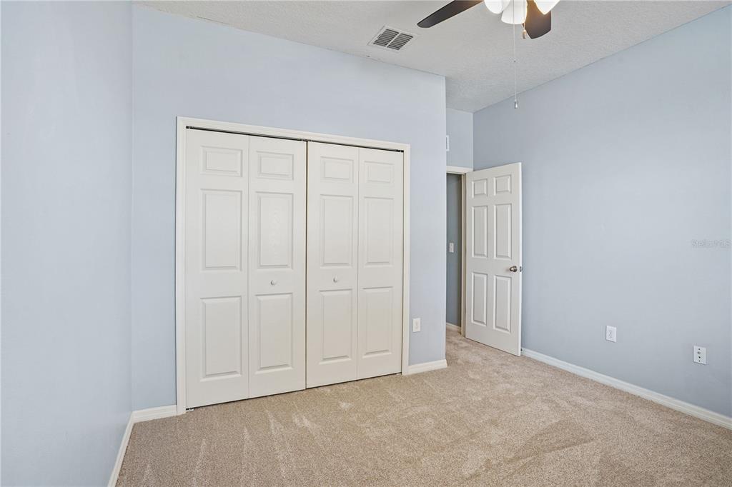 222 Blackstone Creek Road Groveland, FL 34736 - Photo 28 of 49 an empty room with closet area