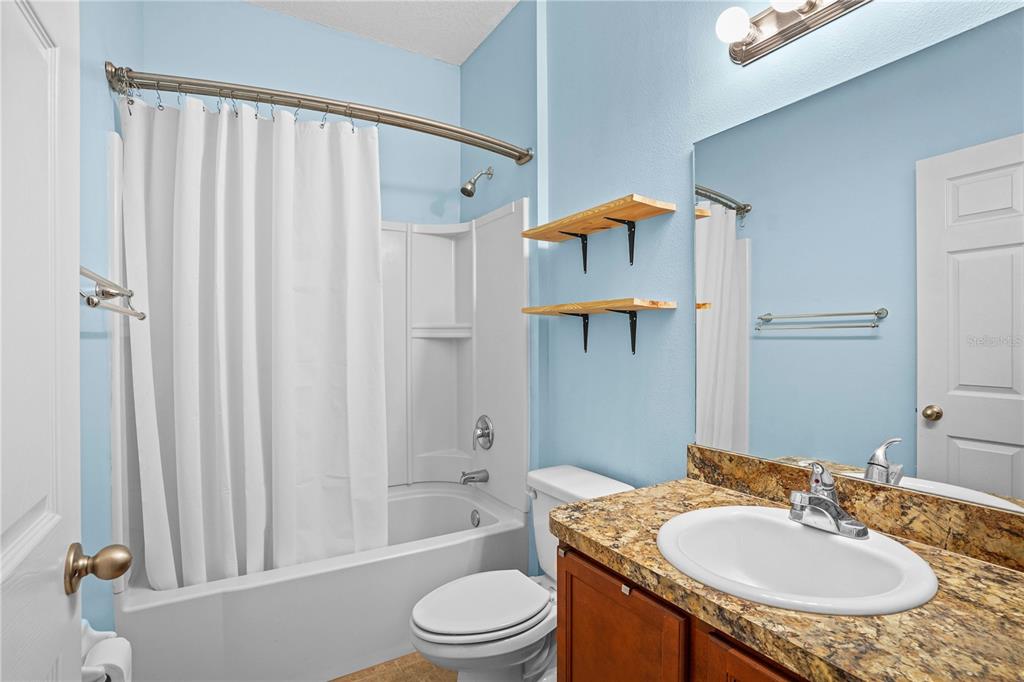 222 Blackstone Creek Road Groveland, FL 34736 - Photo 29 of 49 a bathroom with a sink toilet and shower