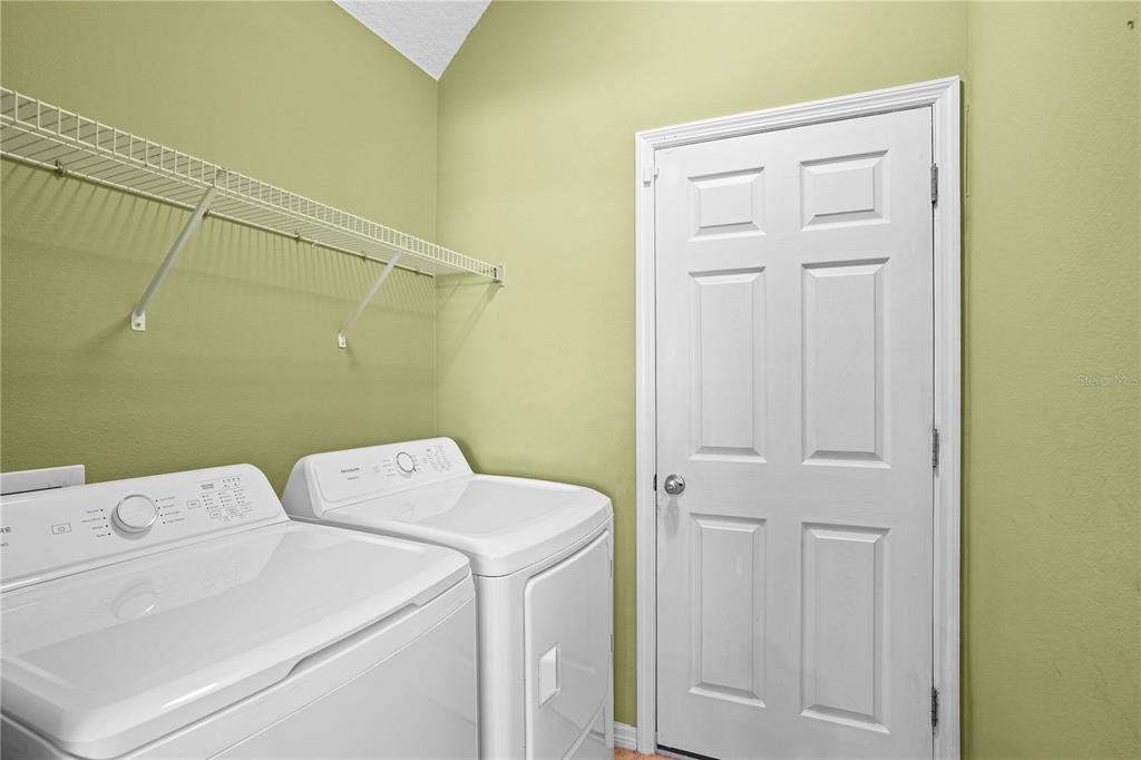 222 Blackstone Creek Road Groveland, FL 34736 - Photo 32 of 49 a utility room with dryer and washer