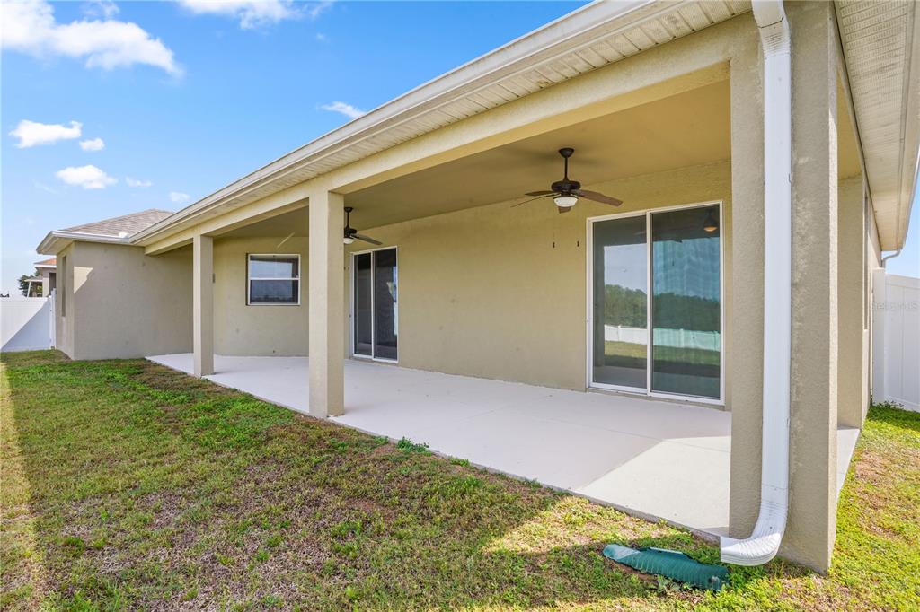222 Blackstone Creek Road Groveland, FL 34736 - Photo 35 of 49 a view of a house with backyard and porch