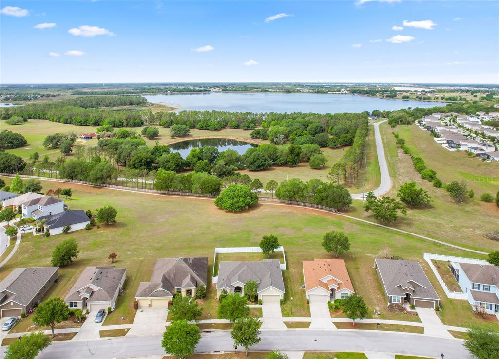 222 Blackstone Creek Road Groveland, FL 34736 - Photo 37 of 49 an aerial view of residential houses with outdoor space and ocean view