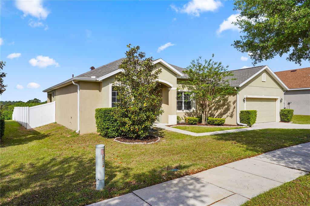 222 Blackstone Creek Road Groveland, FL 34736 - Photo 4 of 49 a front view of a house with a yard