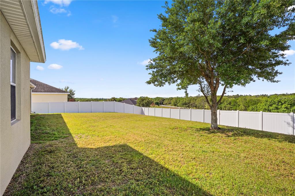 222 Blackstone Creek Road Groveland, FL 34736 - Photo 41 of 49 a view of an swimming pool with an outdoor seating