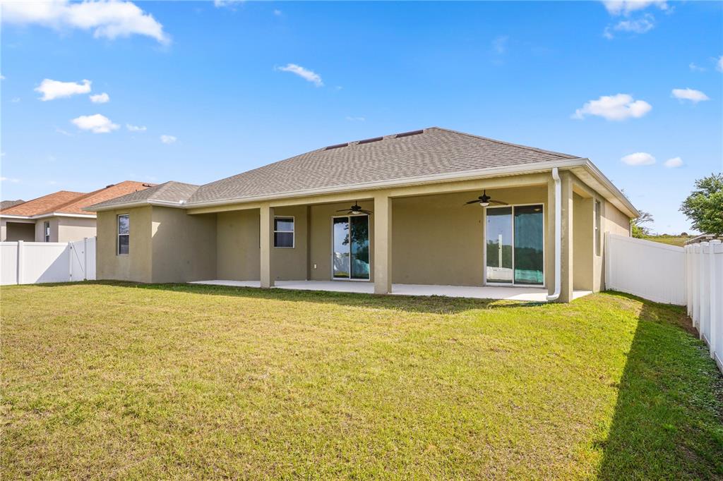 222 Blackstone Creek Road Groveland, FL 34736 - Photo 44 of 49 a front view of a house with a garden