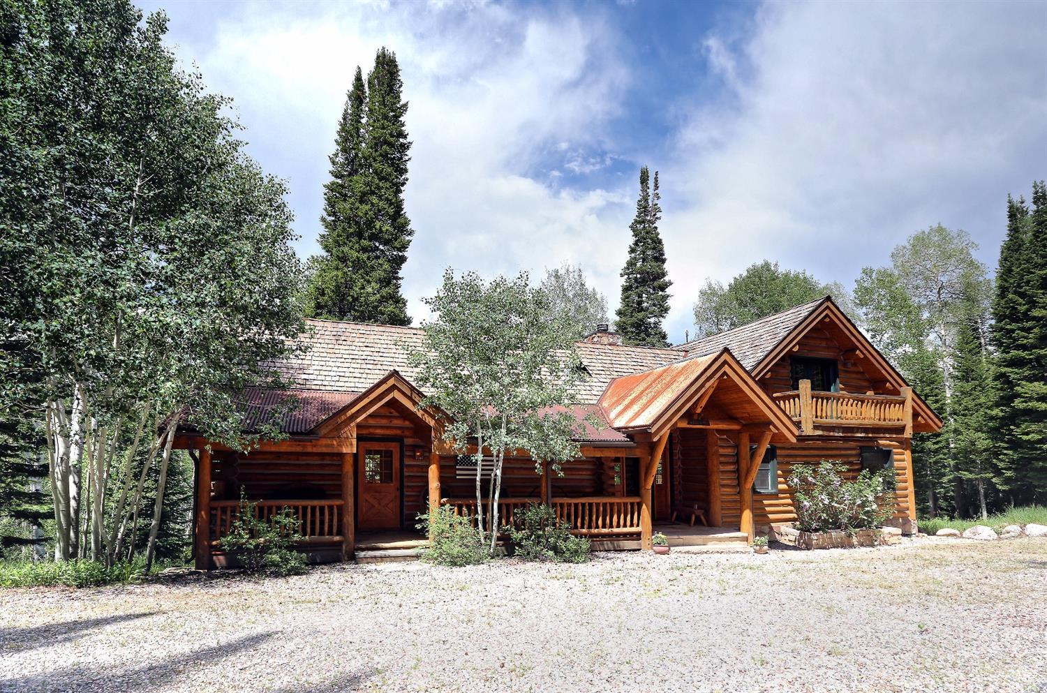 an front view of a house with a yard