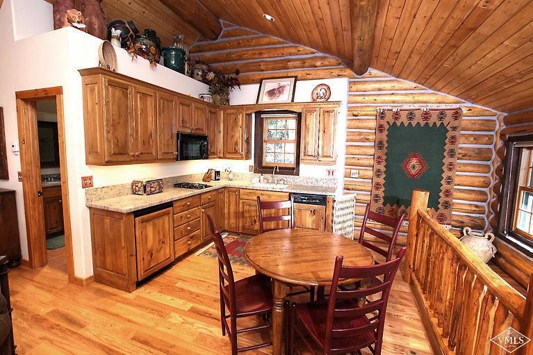4454 Bellyache Ridge Road Wolcott, CO 81655 - Photo 25 of 25 a view of a dinning table and chairs in the patio