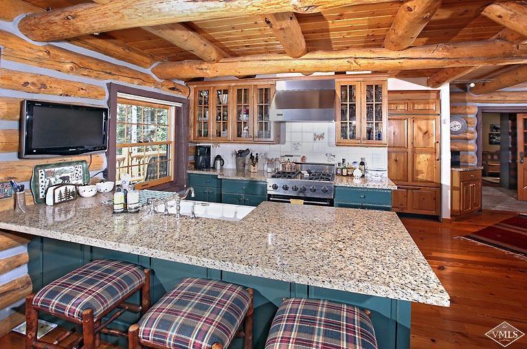 4454 Bellyache Ridge Road Wolcott, CO 81655 - Photo 5 of 25 a kitchen with stainless steel appliances granite countertop a sink and wooden cabinets