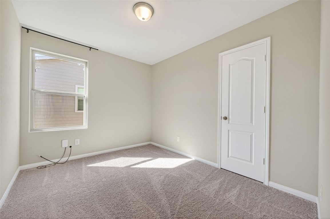 940 21st Street Hempstead, TX 77445 - Photo 18 of 36 a view of an empty room with a window