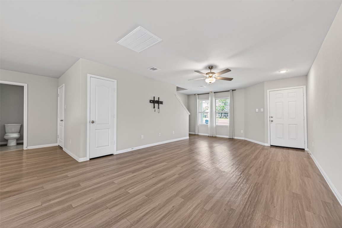 940 21st Street Hempstead, TX 77445 - Photo 6 of 36 a view of an empty room with wooden floor and a window