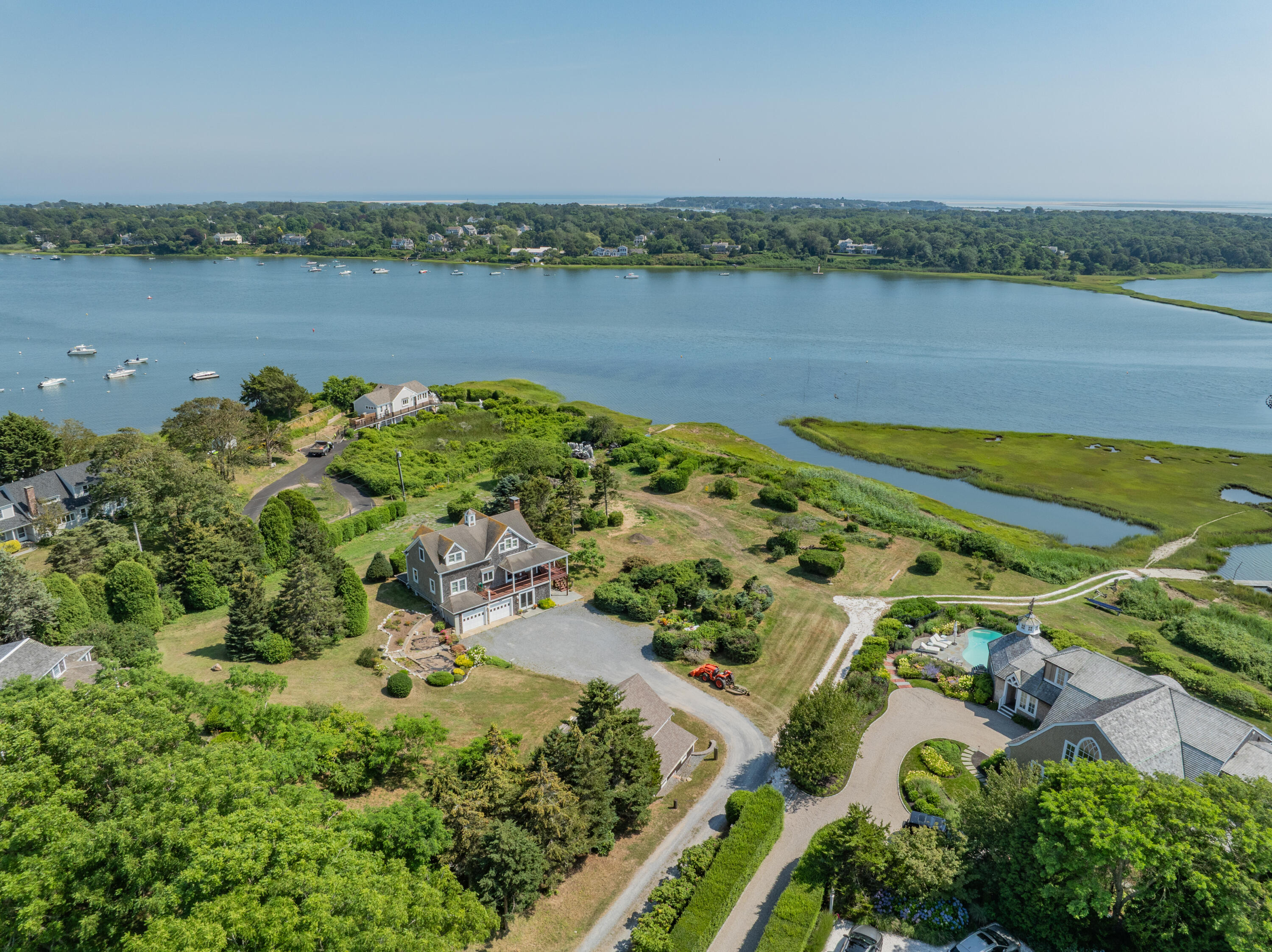 99 Uncle Alberts Drive Chatham, MA 02633 - Photo 1 of 32 a view of a lake with a city