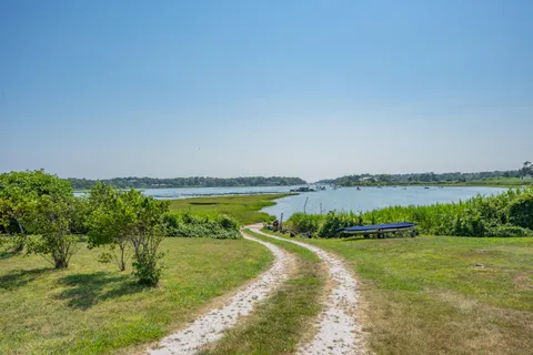 a view of a lake with a yard