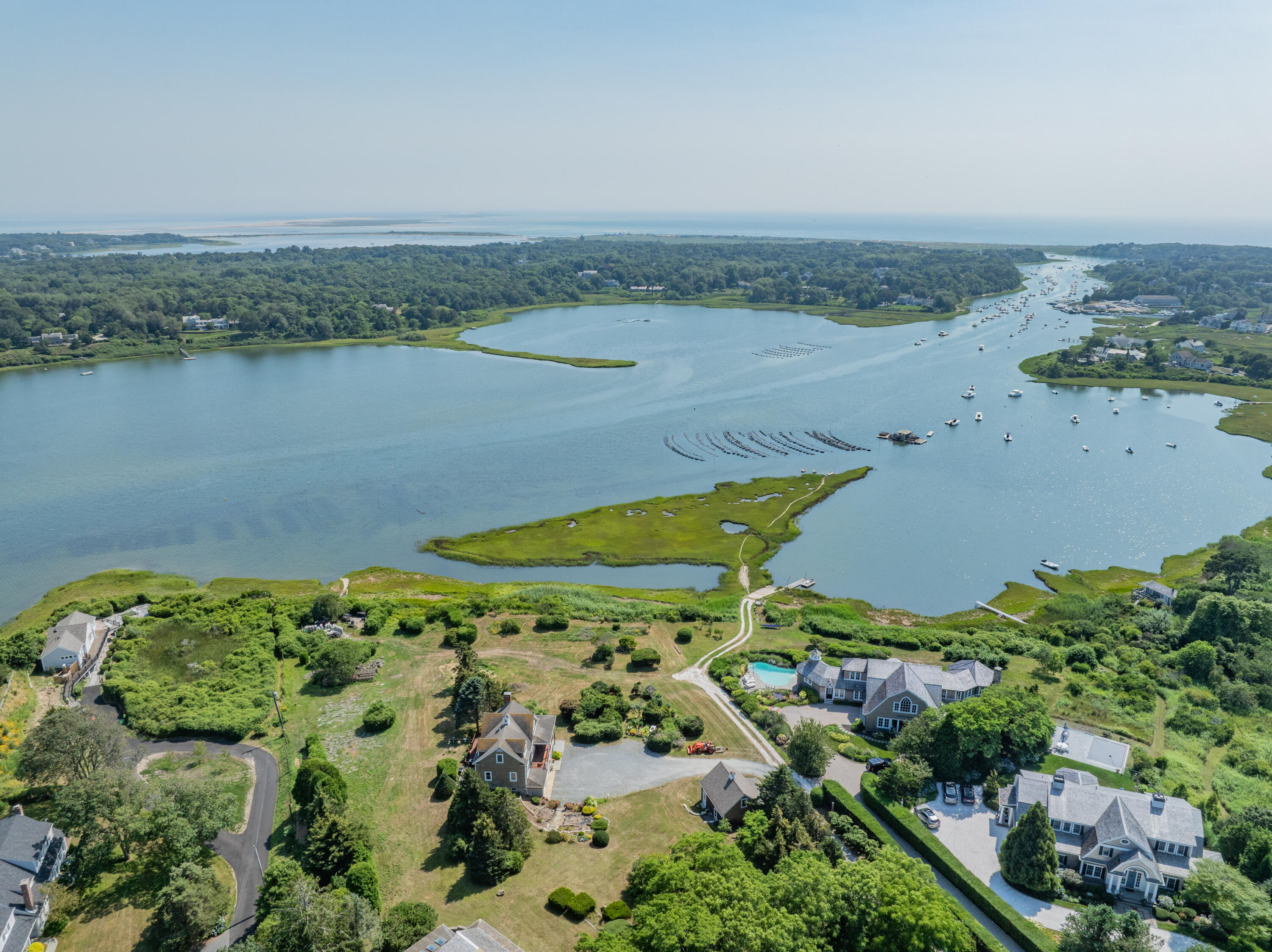 99 Uncle Alberts Drive Chatham, MA 02633 - Photo 20 of 32 a view of a lake with a city