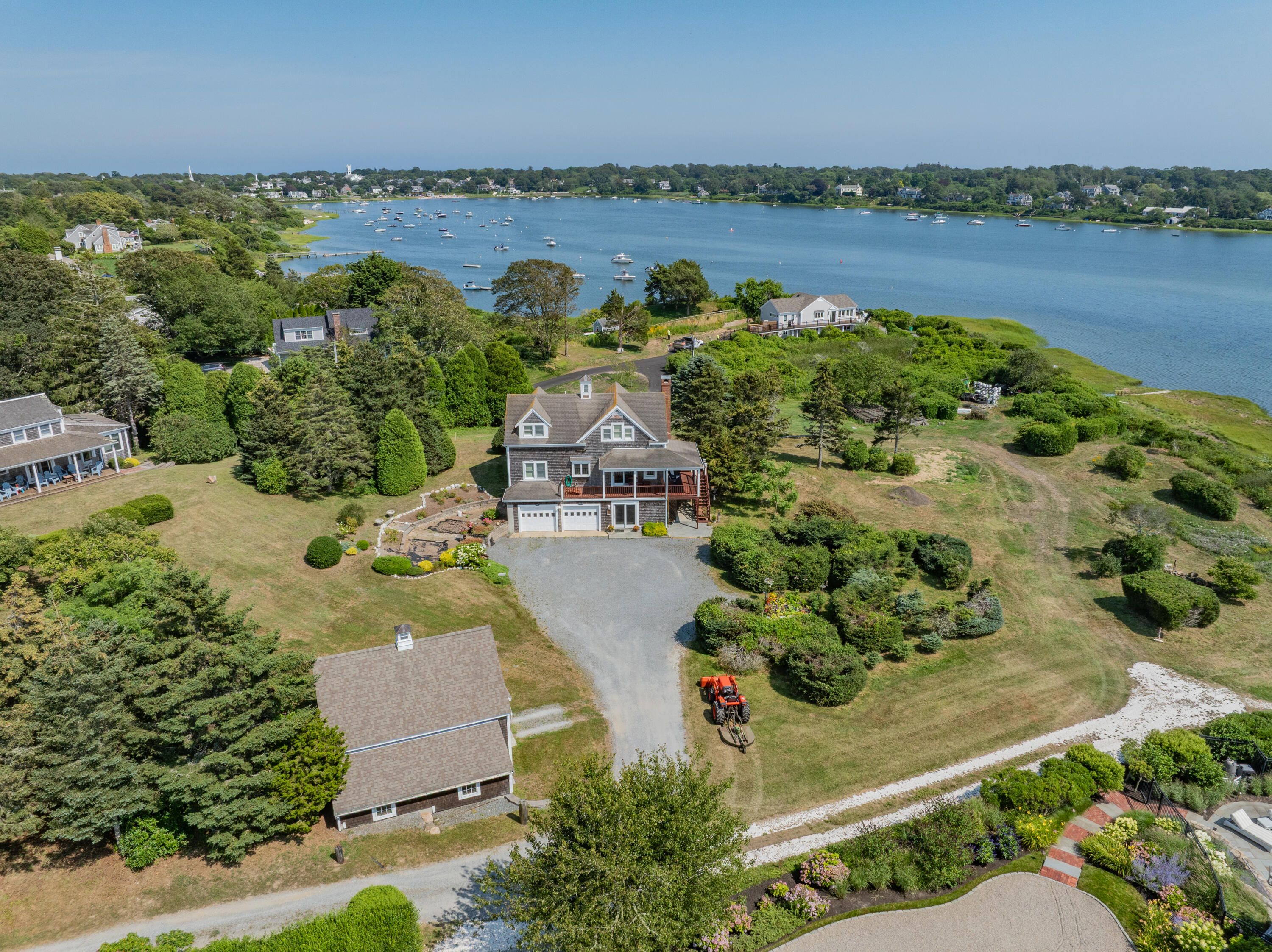 99 Uncle Alberts Drive Chatham, MA 02633 - Photo 2 of 32 an aerial view of a house with outdoor space and lake view