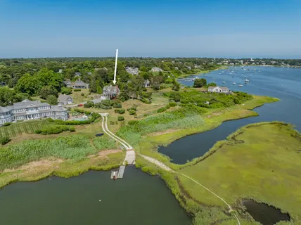 an aerial view of a house with a garden and deck